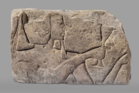 Relief depicting Ramesses II with a ritual vessel, uraeus iconographic, ibes wig iconographic,
