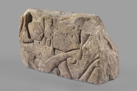 Relief depicting Ramesses II with a ritual vessel, uraeus iconographic, ibes wig iconographic,