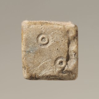 Dice, dice game. Six-sided dice with pips 1–6 shown as hollow circles and dots. Material