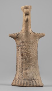Idol, Female figurine, modeled flat, widens towards the bottom creating an oval base, concave