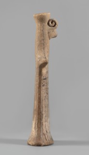 Idol, Female figurine, modeled flat, widens towards the bottom to create an oval base, concave