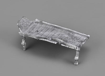 Miniature bed, votive offering or model of furniture; rests on four legs formed from square bars