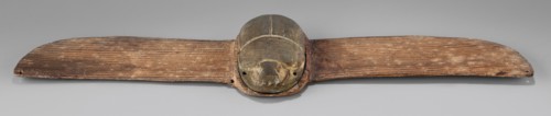 Winged scarab; protective amulet used with mummies and as grave goods; sacred animal motif; scarab