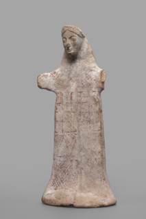 Idol with a full-bodied female head, Standing female figure with a torso flattened on both sides, a