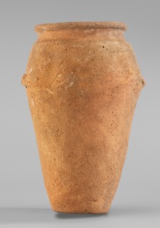 Vessel with wavy handles. Vessel with an elongated belly that widens towards the top. Short,