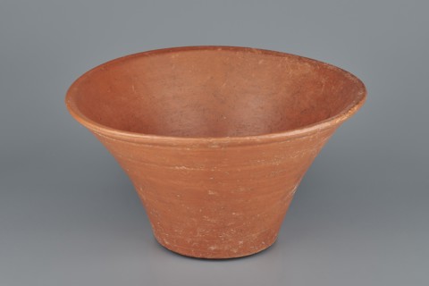 Deep, cup-shaped clay bowl with a slightly convex bottom and sides arching upwards; straight, flat,