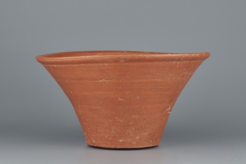 Deep, cup-shaped bowl with a slightly convex bottom and sides arching upwards; straight, flat,
