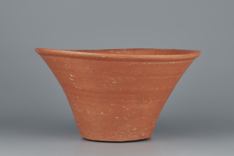 Deep, cup-shaped clay bowl with a slightly convex bottom and sides arching upwards; straight, flat,