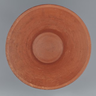 Deep bowl. Cup-shaped clay bowl with slightly convex bottom and sides arching upwards, straight