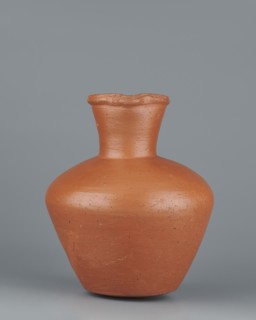Jug. Medium-sized biconical clay jug, widest at about half its height with wide, sloping shoulders.