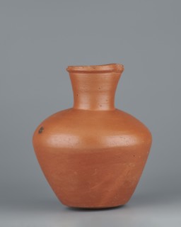 Jug. Medium-sized biconical clay jug with wide, rather sloping shoulders and a wide neck that is