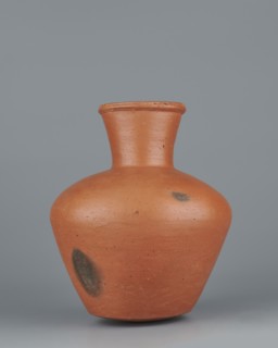 Jug. Medium-sized biconical clay jug with wide, sloping shoulders and a wide neck that is almost