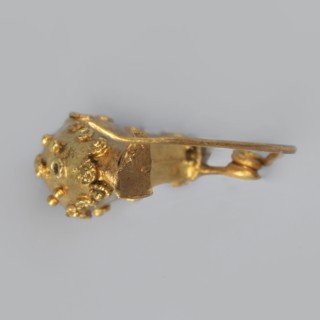 Leech fibula, brooch made of gold plate with a swollen ring decorated with filigree rings and