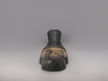 Lid of an anthropoid sarcophagus of a woman with clearly modeled legs. The head is sculpturally