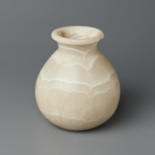 Vessel, Globular stone vessel with a short, wide neck and a large upturned spout, with a flattened