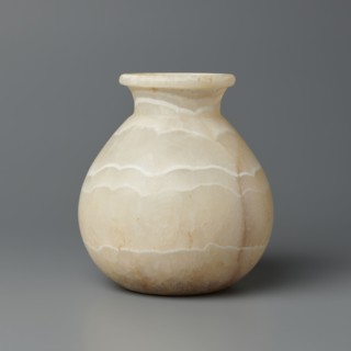 Vessel, globular vessel with a short, wide neck and a large upturned spout, flattened bottom,