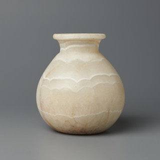 Vessel, globular vessel with a short, wide neck and a large upturned spout, flattened bottom;