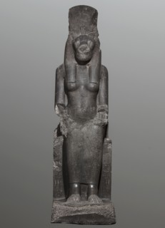 Statue of the goddess Sekhmet. Woman with a lioness's head seated on a throne, dressed in a long