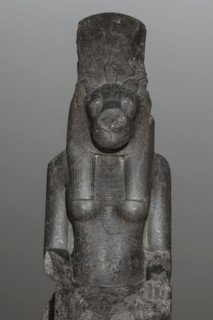 Statue of the goddess Sekhmet. Woman with a lioness's head seated on a throne, dressed in a long,
