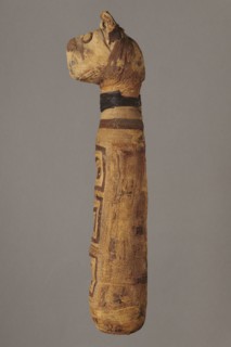 Cat mummy, unknown author; Cat mummy decorated with a meander made of white and brown bandages; 30