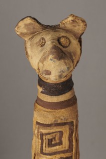 Cat mummy, Cat mummy decorated with a meander made of white and brown bandages. Materials: fabrics,