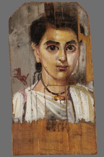 Mummy portrait of a boy. Portrait of a boy painted on a small board with diagonally cut upper