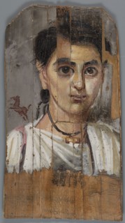 Mummy portrait of a boy. Portrait of a boy painted on a small board with diagonally cut upper