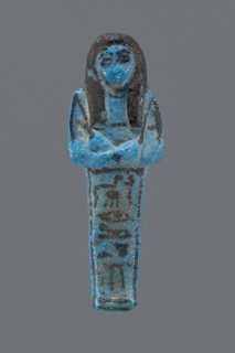 Ushabti Henut-netjeru. Mummy-shaped figurine shabti. Arms crossed on the chest, right folded over