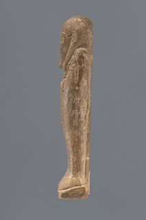 Ushabti, Mummy-shaped figurine standing on a base with a pilaster at the back. Arms crossed on the