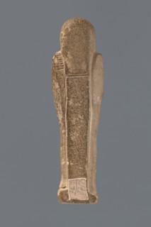 Ushabti, mummy-shaped figurine standing on a base with a pilaster at the back. Arms crossed on the