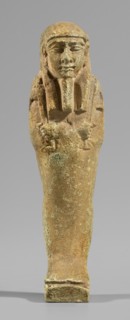 Ushabti, wig and beard, funerary figurine Mummy-shaped shabti standing on a base, supported at the