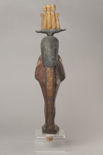 Osiris, Osiris mythology. Figurine in the form of a human mummy wearing a hemhem crown with ram's