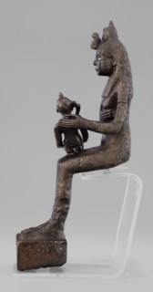 Figurine of the goddess Isis nursing Horus. The figurine depicts a seated Isis with the child Horus