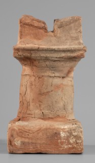 Horned altar serving as a censer, ceremonial vessel/altar. Square base, cylindrical shaft with
