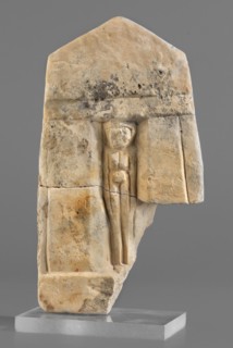 Naos stele with a female figure, small naos-shaped stele slightly tapered at the top and