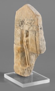Naos stele with a female figure; small naos-shaped stele, slightly tapered at the top and