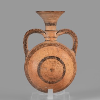 Bottle, Amphoriskos amphora with a round, slightly flattened flask-like belly. Brown-black