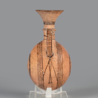 Bottle;, Amphoriskos amphora with a round, slightly flattened flask-like belly. Brown-black