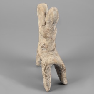 Figurine of a rider on a horse. The entire piece is schematic, the overall shape is highlighted,