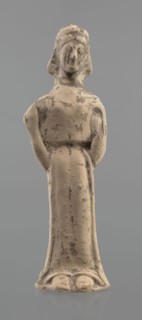 Terracotta figurine of a woman, unknown Boeotian workshop. Mold-pressed terracotta figurine of a