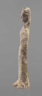 Terracotta figurine of a woman, unknown Boeotian workshop. Female mold-pressed figurine. Standing
