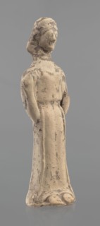 Terracotta figurine of a woman, unknown Boeotian workshop. Mold-pressed terracotta figurine.