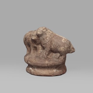 Two dogs, Two dogs shown schematically on a round, profiled base. The dogs are shown standing, with