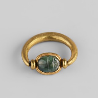Ring with a scarab and a cryptogram of Amun; Amun mythology, ankh iconography, plant decorations;