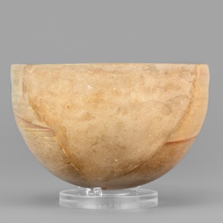 Bowl, unknown Northern Mesopotamian workshop. A hemispherical bowl topped with a simple rim,