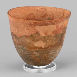 Mug, unknown Northern Mesopotamian workshop. Mug with slightly S-shaped walls and a small flat