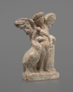 Terracotta figurine of Eros with a goose. Figurine of a standing Eros, positioned frontally,