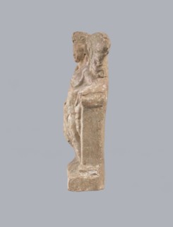 Terracotta figurine of Eros with a goose. Terracotta; figurine of a standing Eros produced from a
