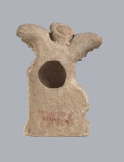 Terracotta figurine of Eros with a goose. Terracotta; figurine of a standing Eros molded from a