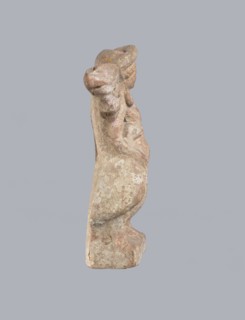 Terracotta figurine of Eros with a goose. Terracotta, figurine from a mold, figurine of a standing